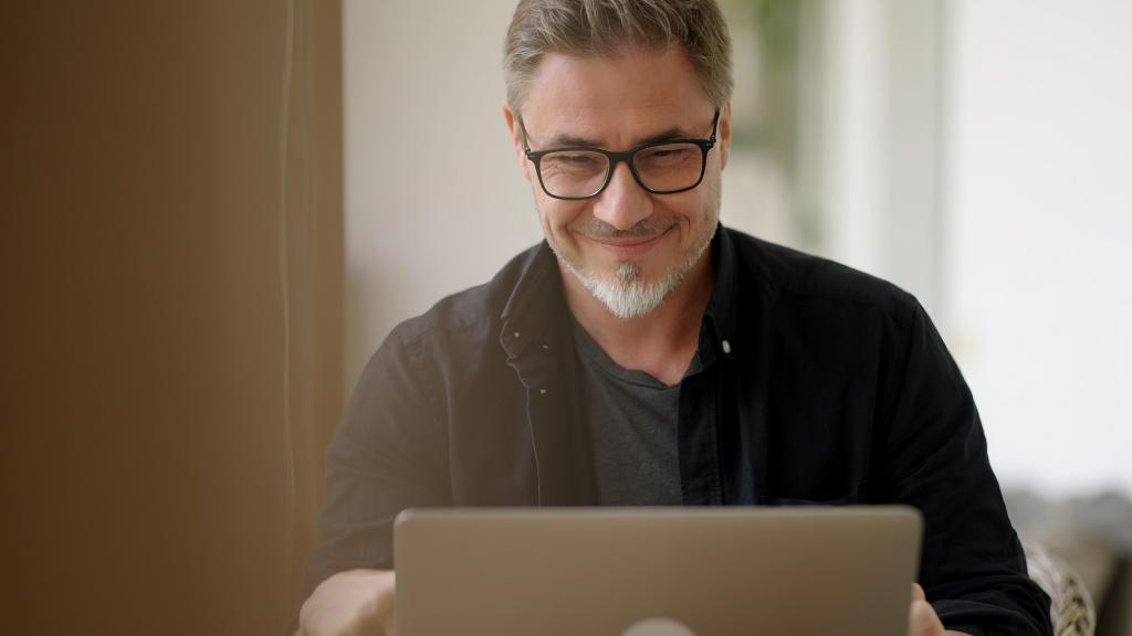 Man working with laptop at home outdoor on terrace