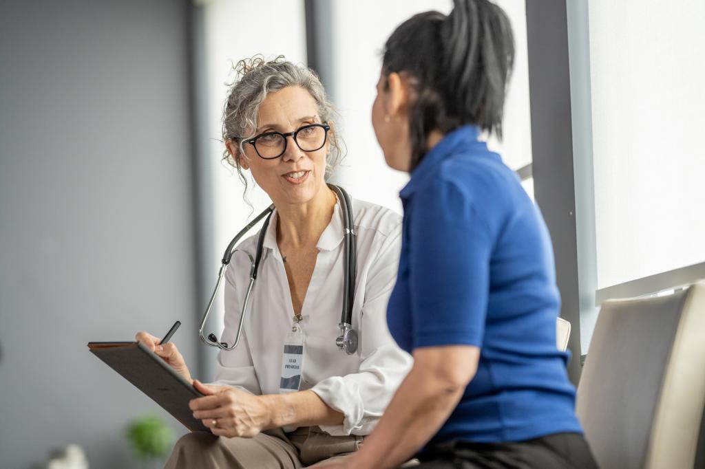 Doctor Consulting with Patient During a Medical Appointment in Clinic Setting