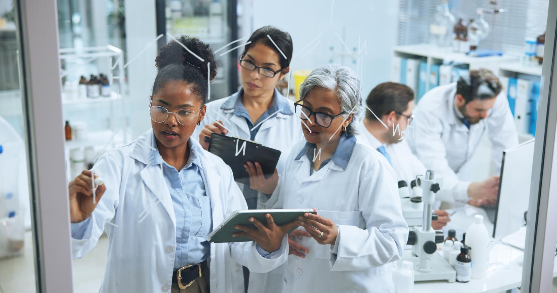 Science, glass wall and team in lab with tablet, collaboration and notes for genetic study. Medical, support and researcher in clinic with writing board, problem solving and analysis of dna formula.