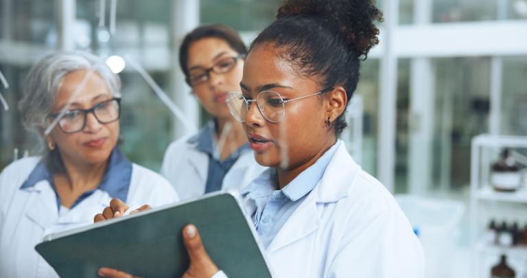 Medical, glass wall and women in lab with tablet, collaboration and notes for genetic study. Science, support and researcher in clinic with idea board, problem solving and analysis of dna formula.