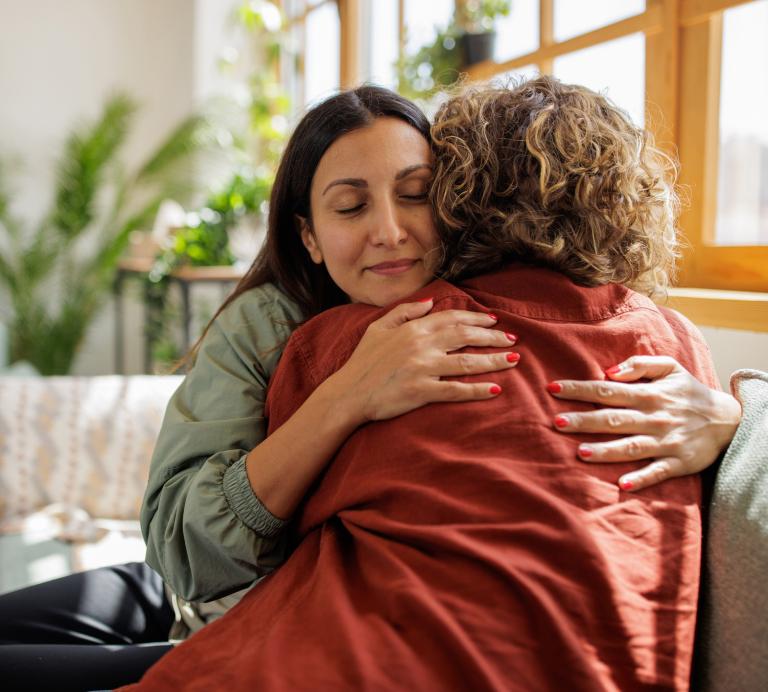 Women supporting each other at home