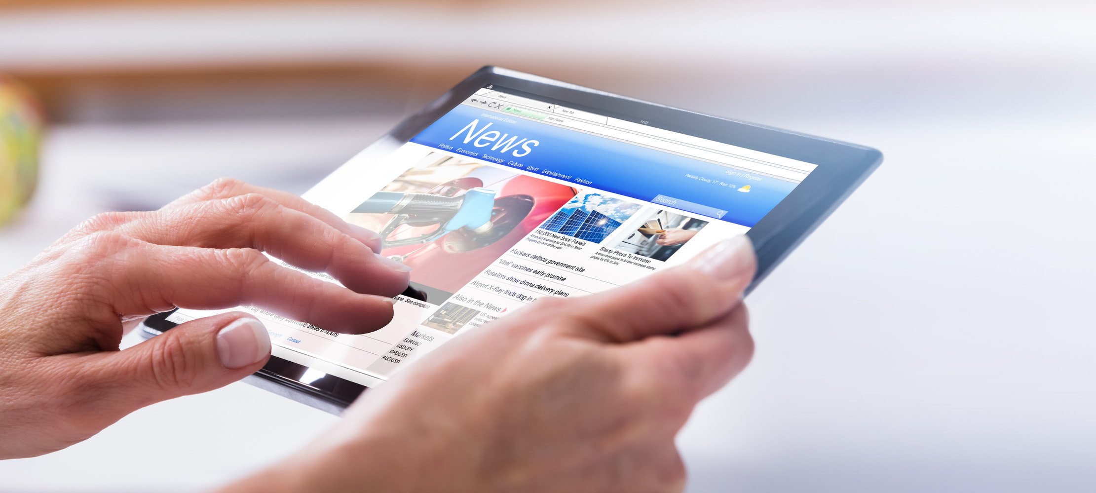 Close-up Of A Person's Hand Using Digital Tablet