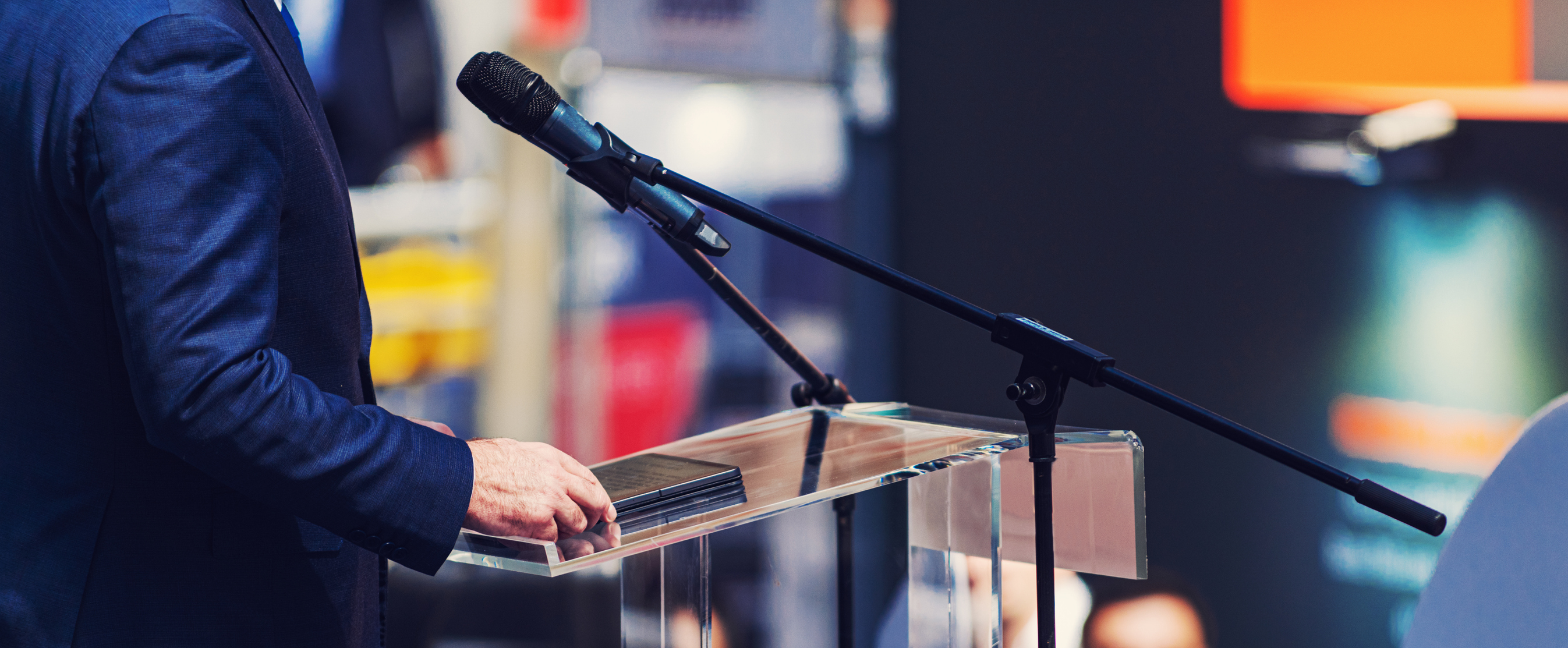 Midsection Of Man Holding Digital Tablet While Standing By Microphone
