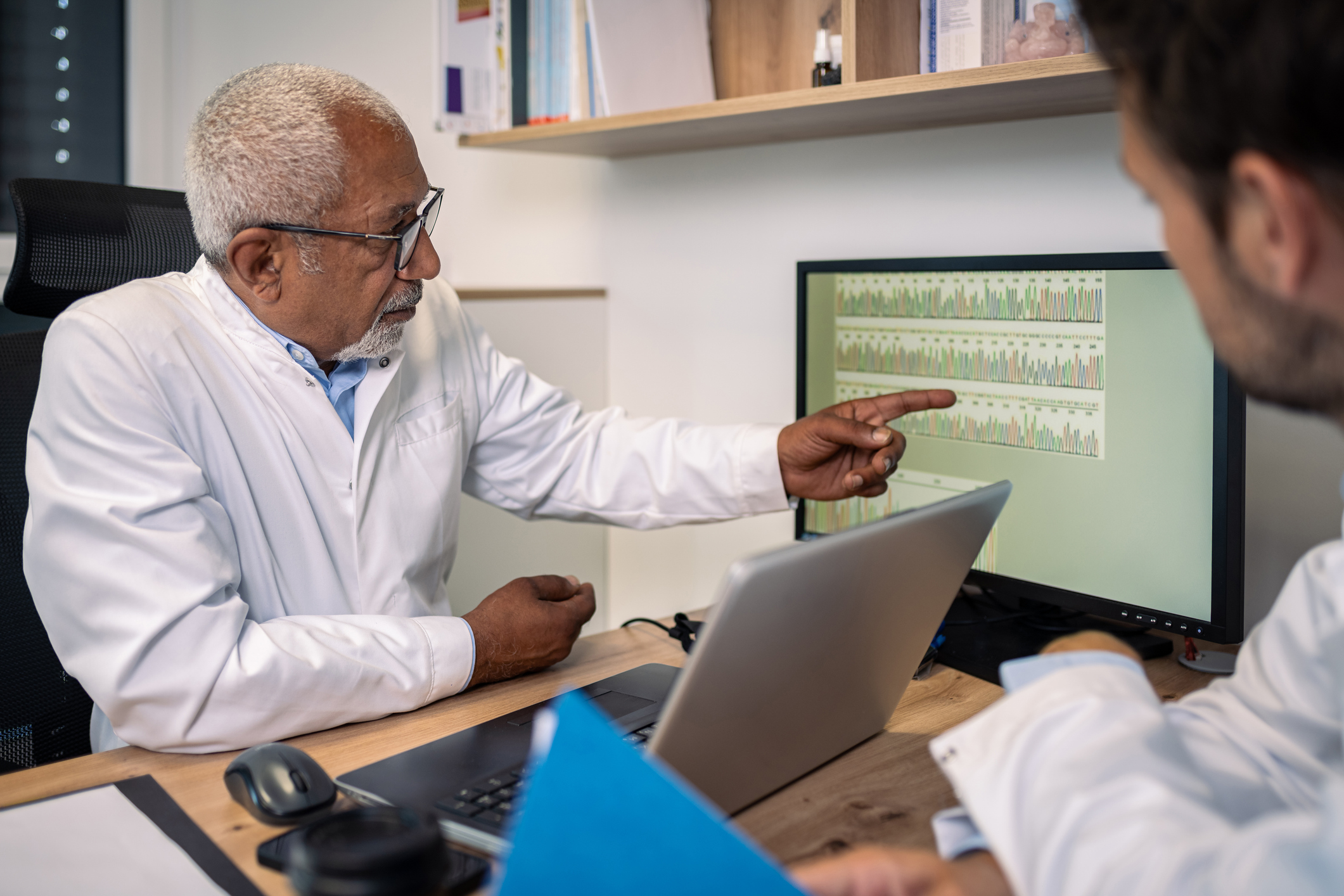 Medical professionals analyzing and sharing DNA data.