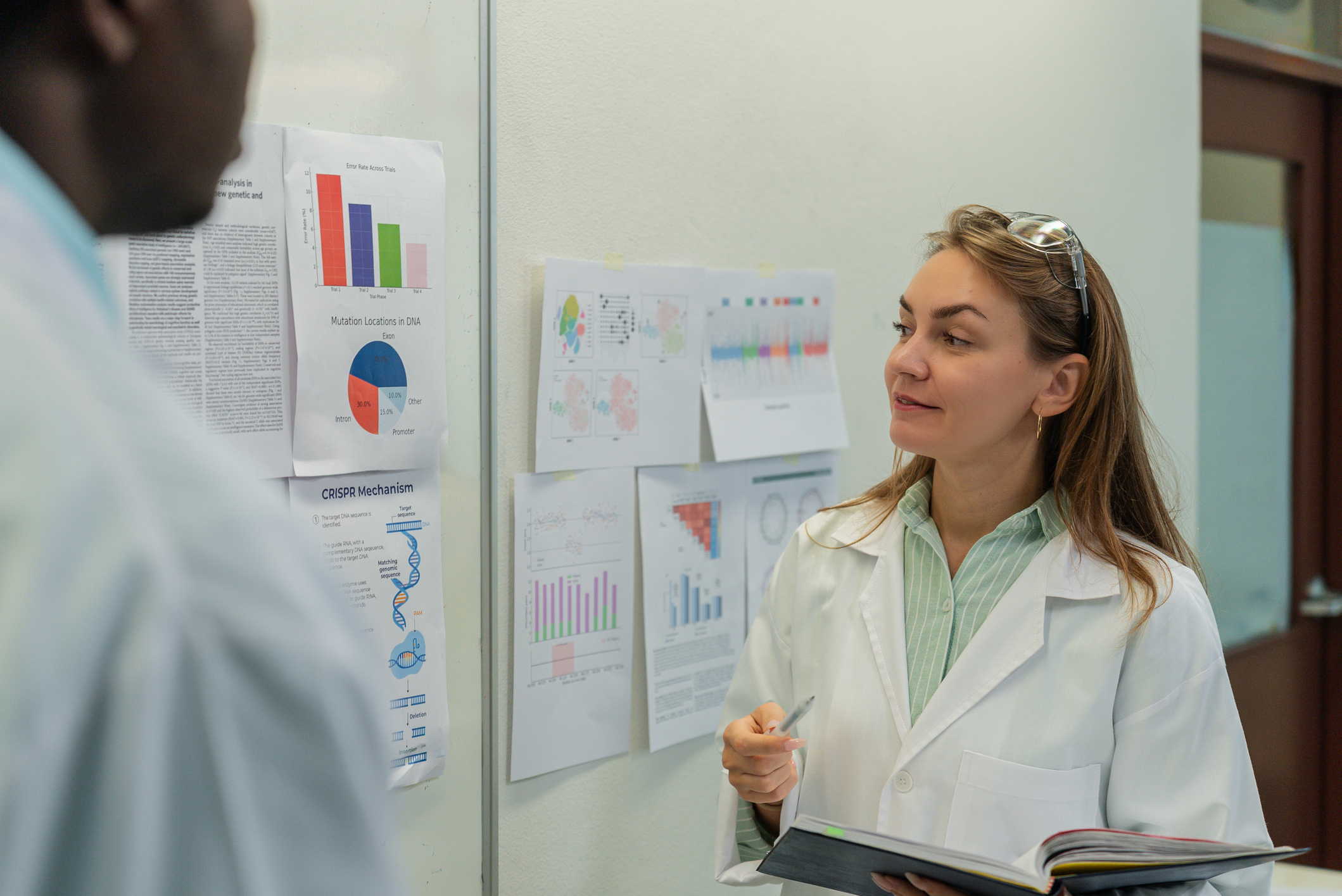 Scientists Discussing Research Data and Results in Laboratory